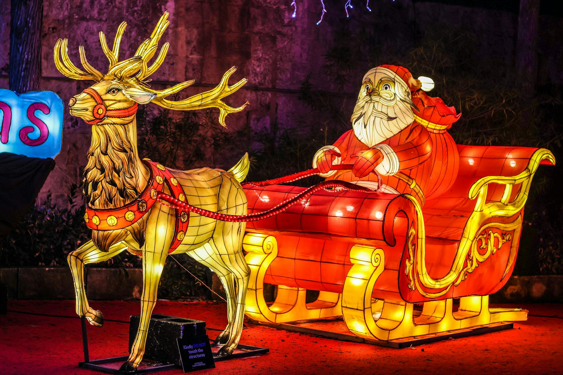 festive santa and reindeer decoration at night