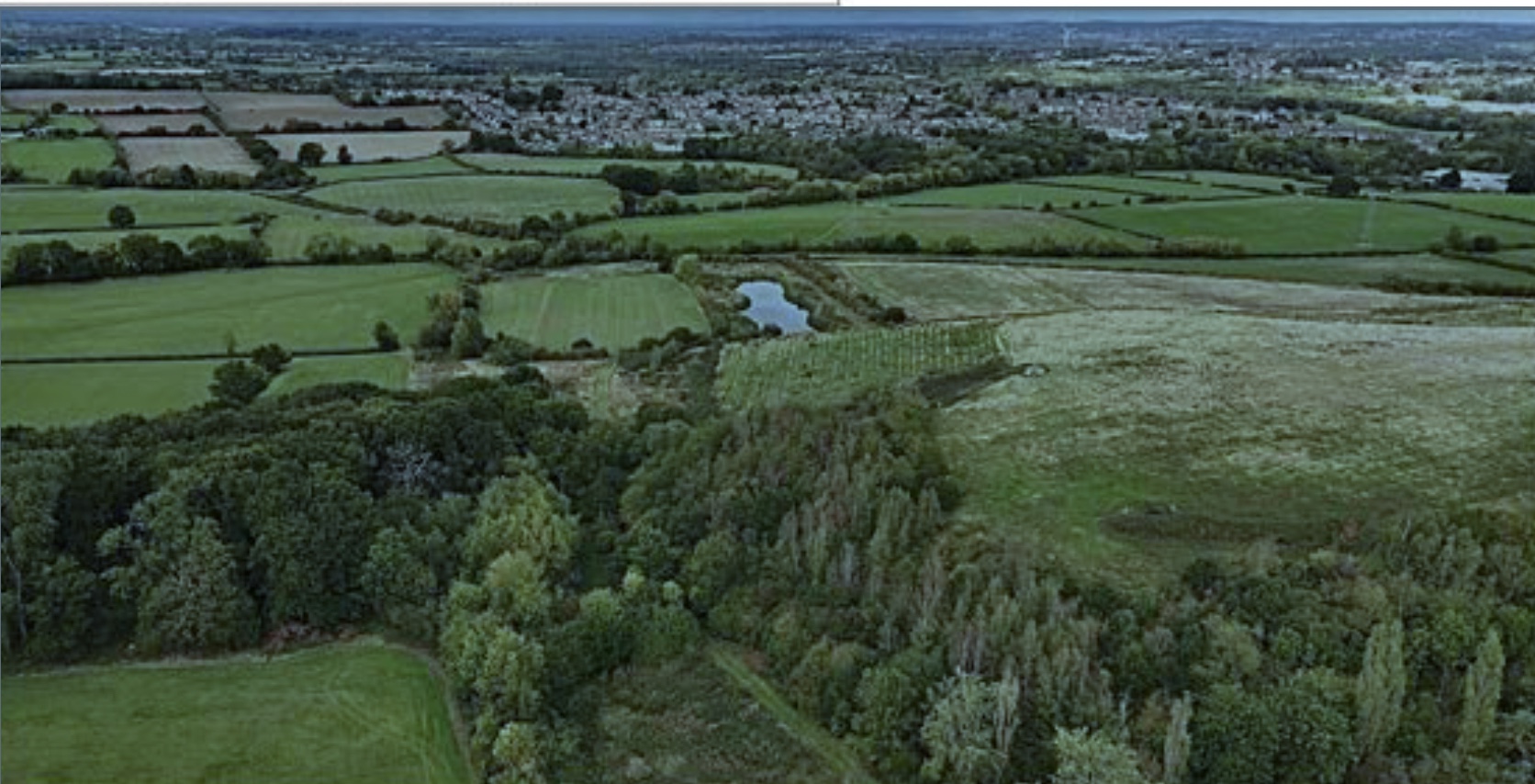 Aerial photo of countryside, including the capped site which was previously used for industrial tipping